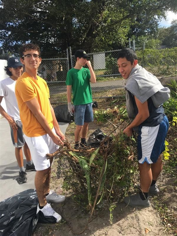 Key Clubbers helping with old fencing 